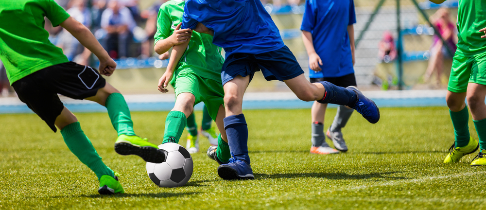 Running,Young,Soccer,Football,Players.,Footballers,Kicking,Football,Match,Game. Ramadan fasting in women's soccer