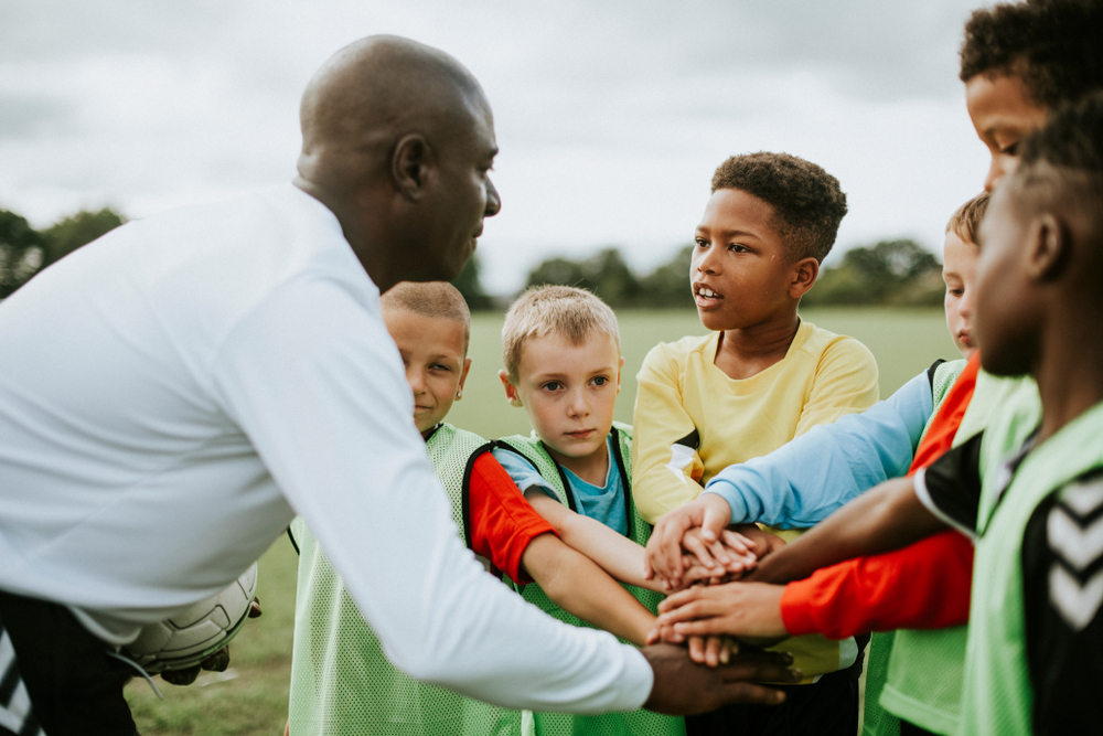 Junior,Football,Team,Stacking,Hands,Before,A,Match the nutrients footballers need